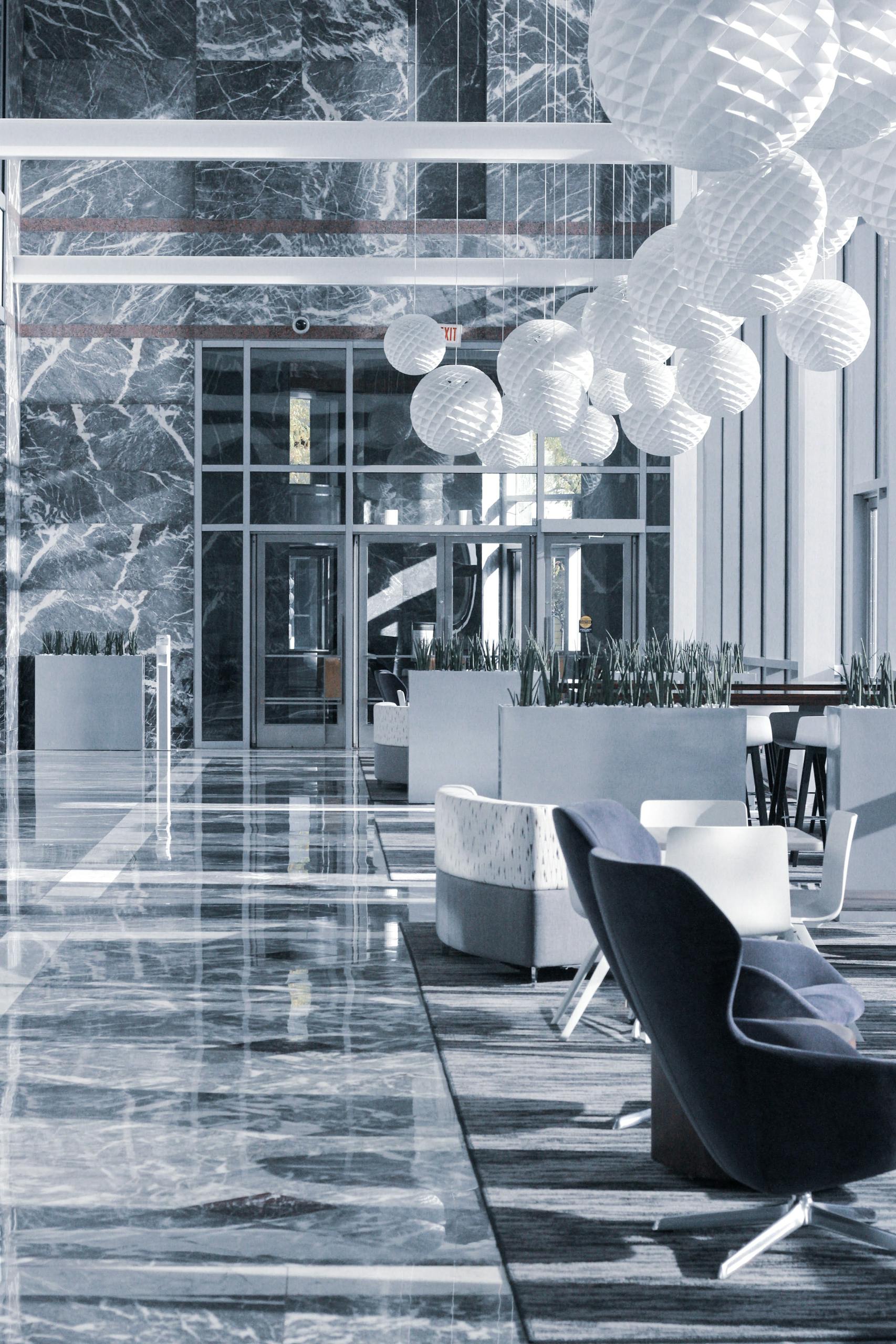 Elegant hotel lobby with marble floors and modern furniture design.
